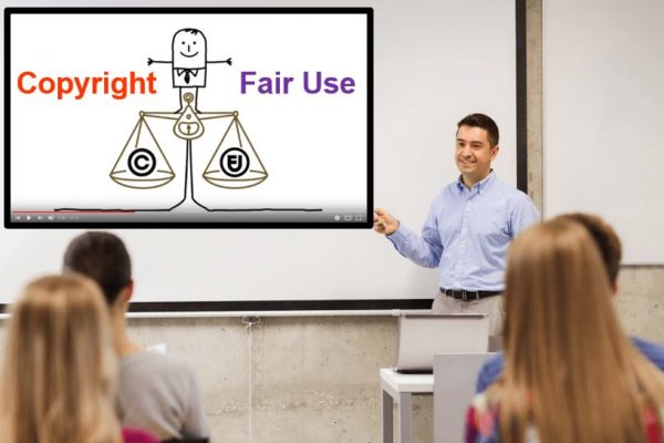 Teacher in classroom setting pointing towards a copyright fair use video clip on the whiteboard